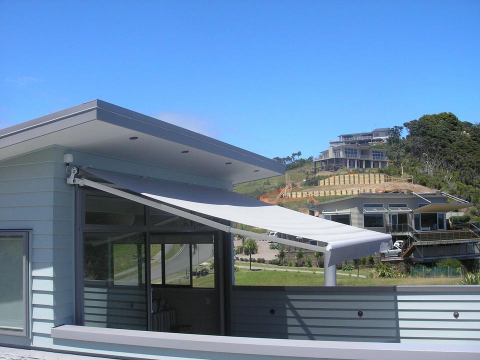Retractable folding arm awning on a Sydney home