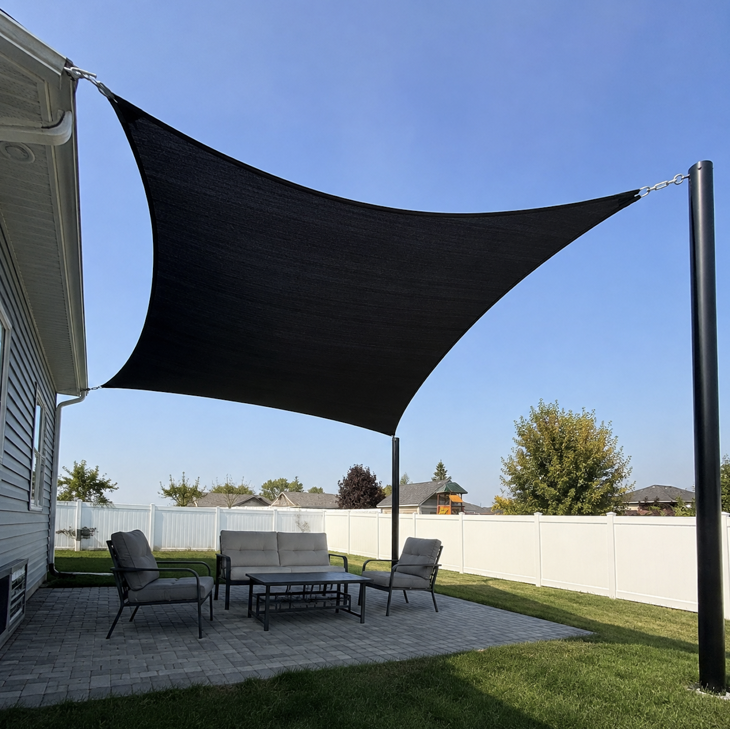Custom shade sail installed over a Sydney carport